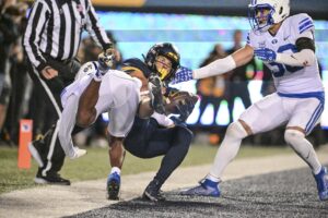 West Virginia gets strong rushing efforts from Jahiem White and CJ Donaldson in a 37-7 win over BYU